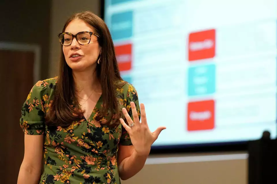Sydney presenting at a conference